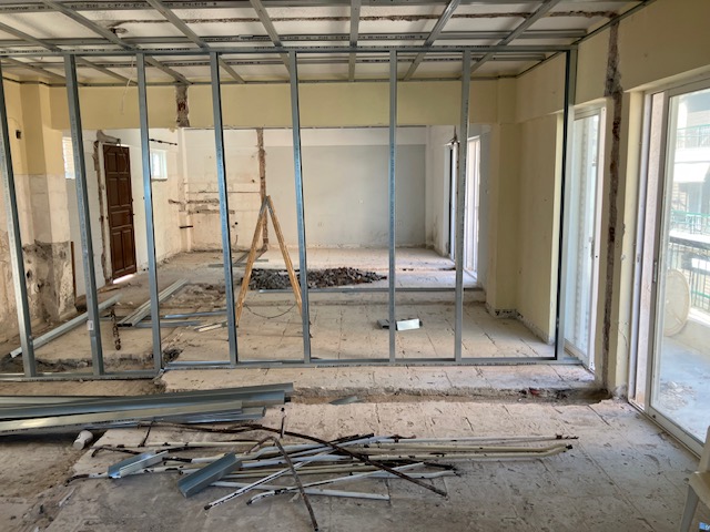 Newly framed rooms with partition studs defining the internal layout.