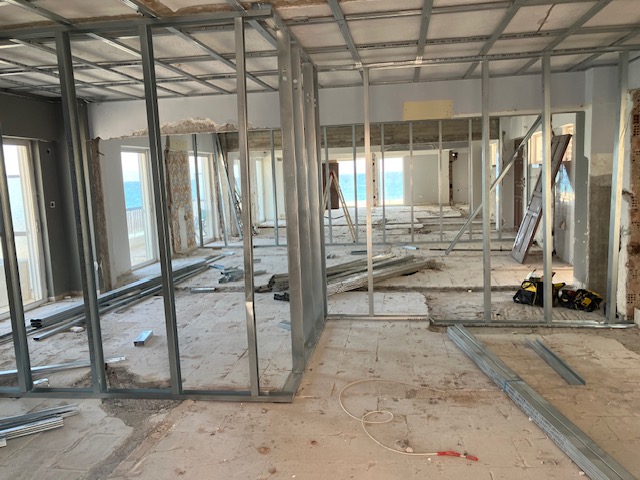 Partition framing across the floor plate with a long architectural perspective.