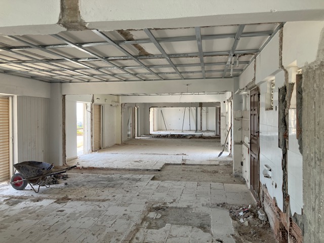 Wide interior view showing the depth and scale of the residence during construction.